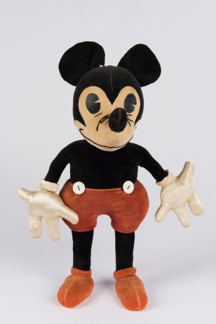 An original 1930 Mickey Mouse plush doll designed and hand made by Mrs. Charlotte Clark. Courtesy of Walt Disney Archives Photo Library.